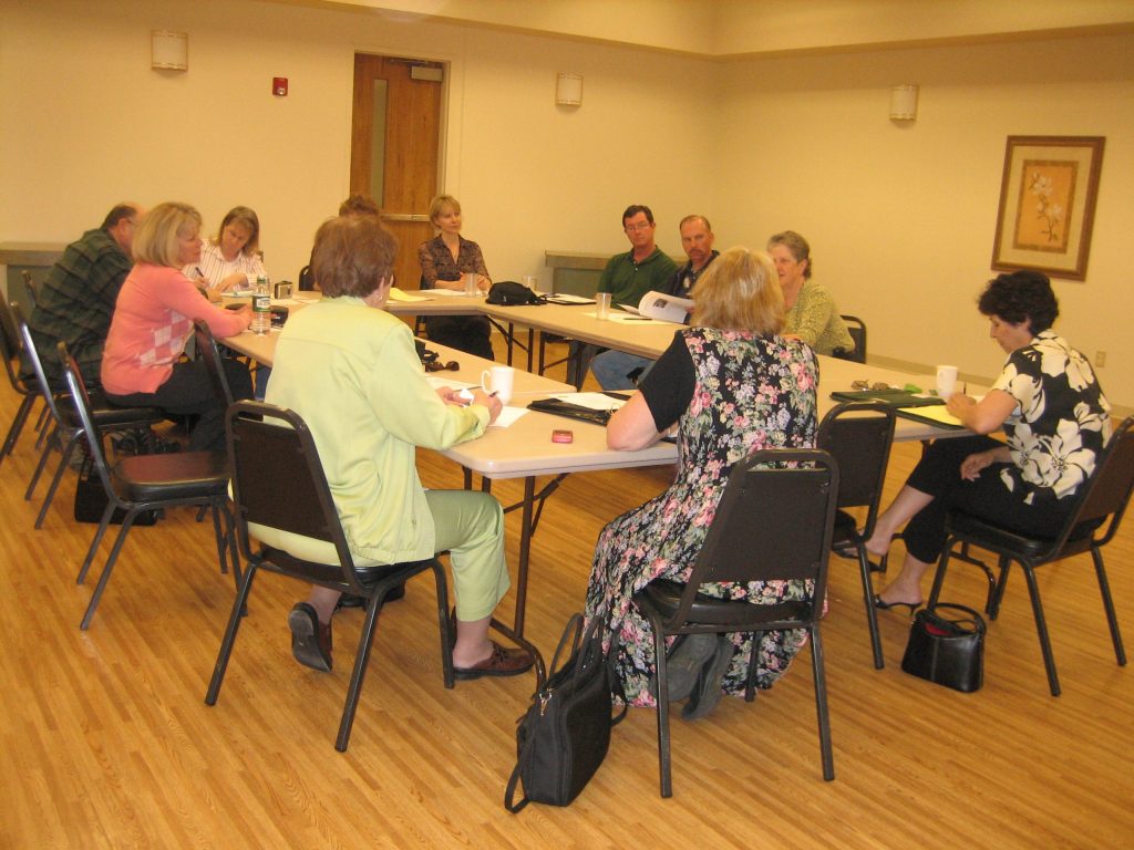 Members seated around a table at an SRTA meeting